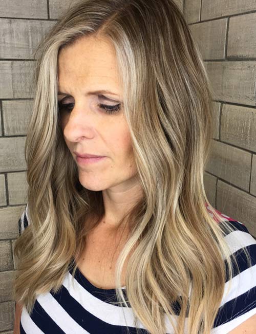 3. Ash Blonde Highlights On Long Wavy Hair
