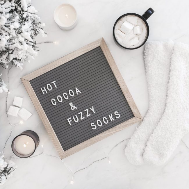 Hot cocoa and fuzzy socks letterboard with a cup of hot cocoa