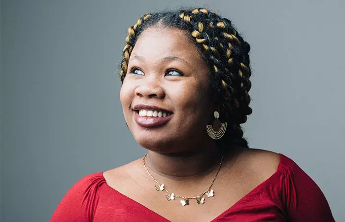 A happy woman with box braids