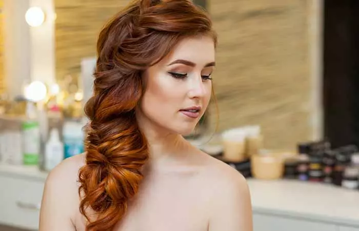 woman with messy side braids