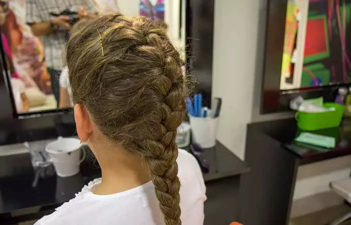 a girl with French braids