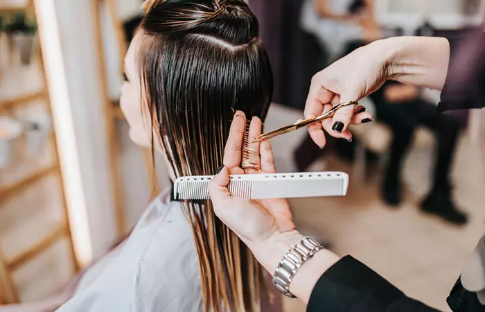 A woman getting a haircut at the hair salon